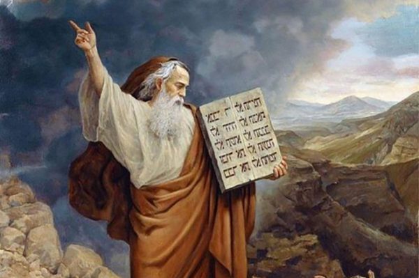 Moses holding ten commandements